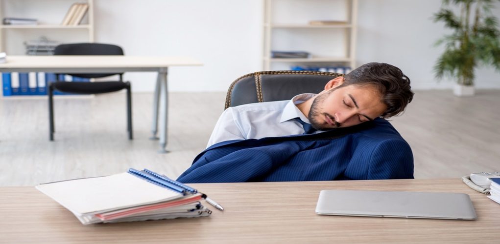 Young,Male,Employee,Extremely,Tired,In,The,Office